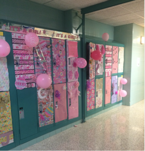 Freshmen lockers decorated pretty in pink with “It’s a Girl!” signs and rattles taped to the lockers by the juniors to show love to their baby sisters. Photo courtesy of Emily Ash'19